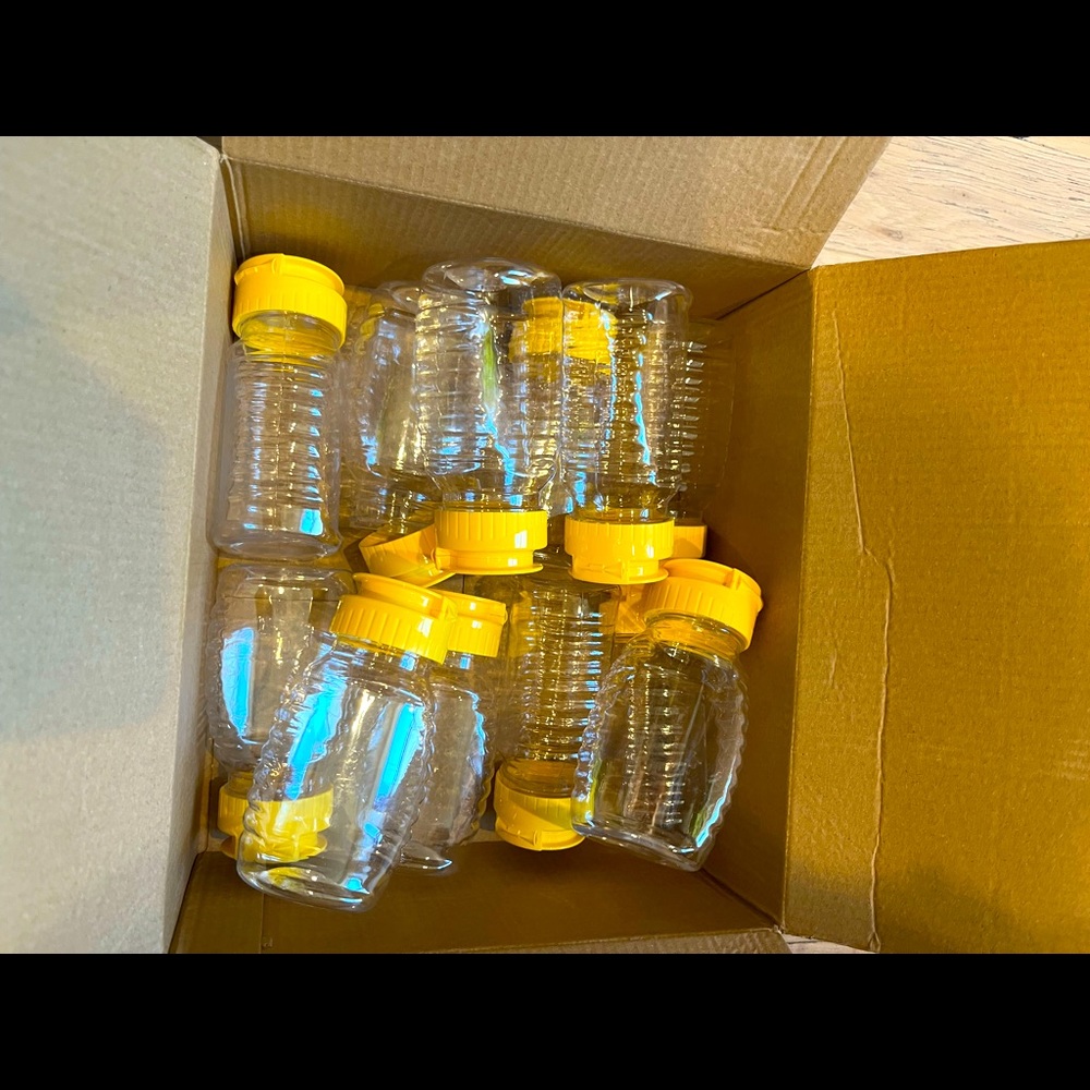 Small plastic honey or condiment squeeze bottles